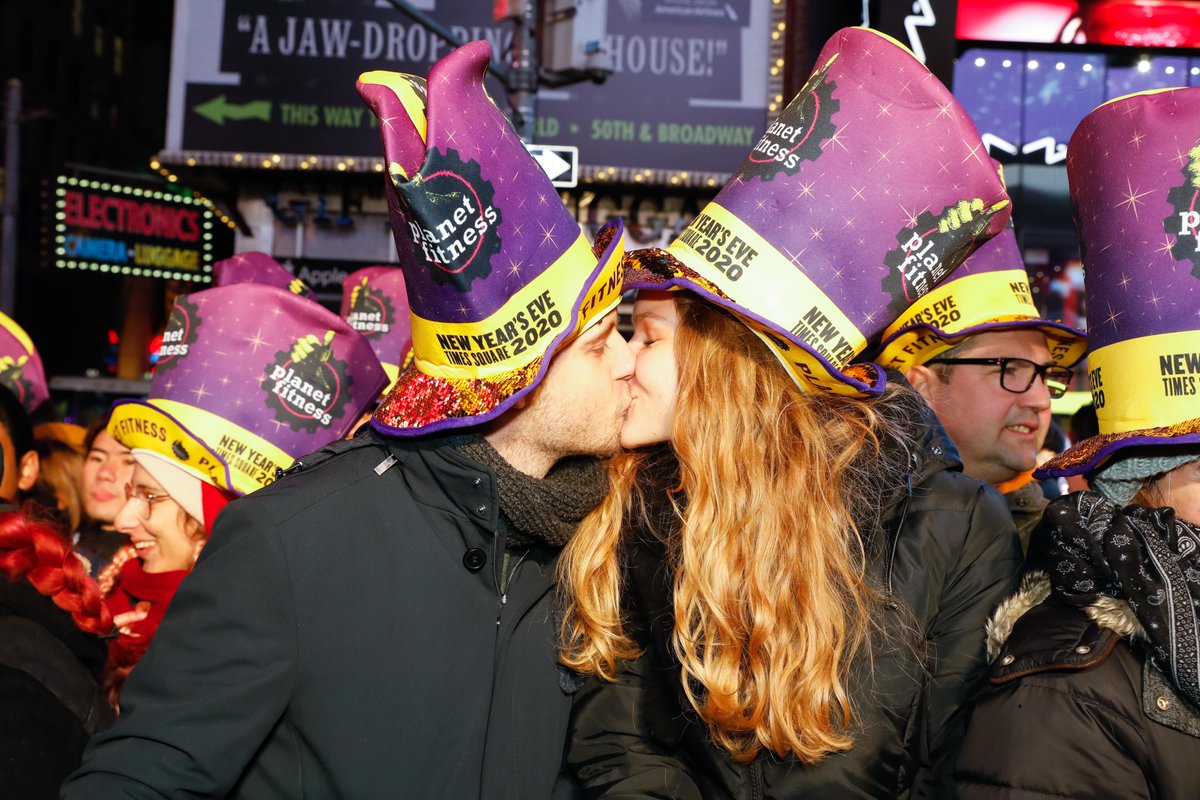 Times Square on X: Revelers create a sea of purple & yellow as they don  their @PlanetFitness hats with pride. #BallDrop  / X