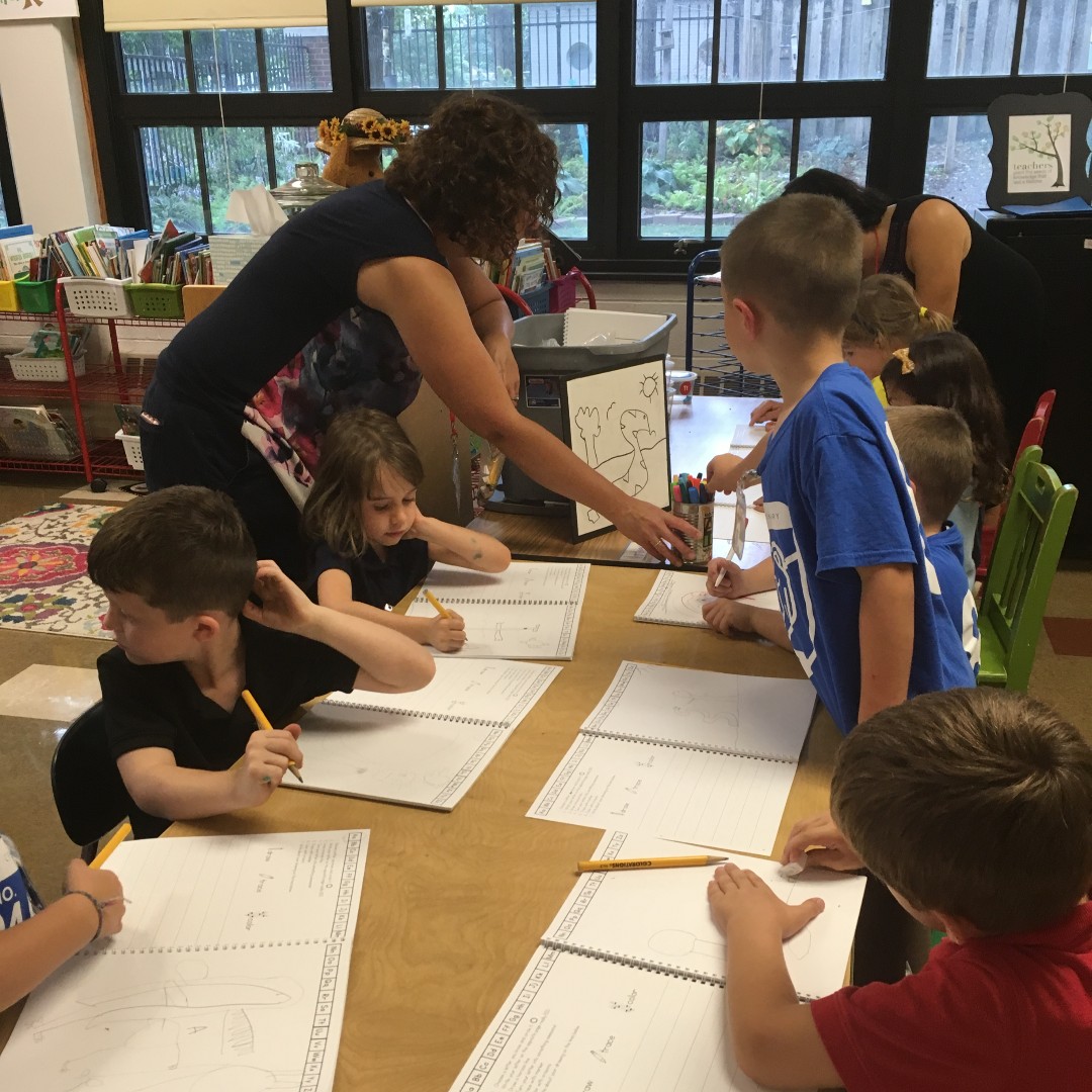 ArtWithAHeart2's tweet photo. Last year, we had the help of over 130 volunteers! Most of them help in our in-school program. This small group of students work with their volunteer to draw and write, practicing both art and composition. https://t.co/Jr0hLLlhFg