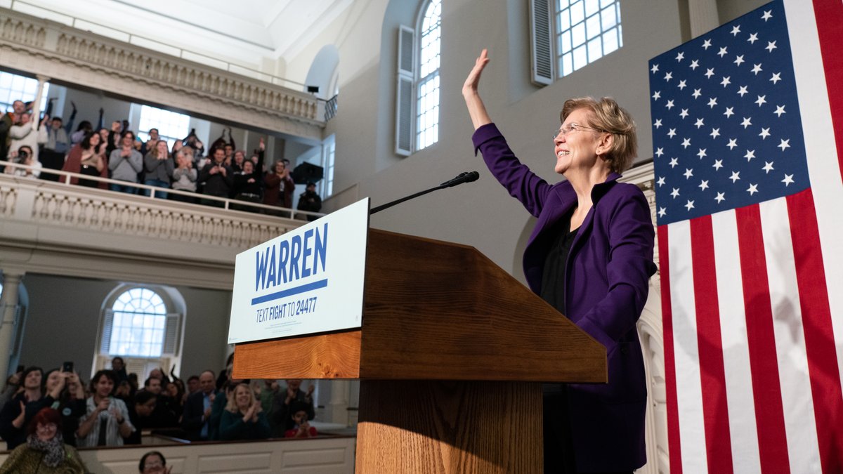 Elizabeth Warren waves to a crowd of supporters.