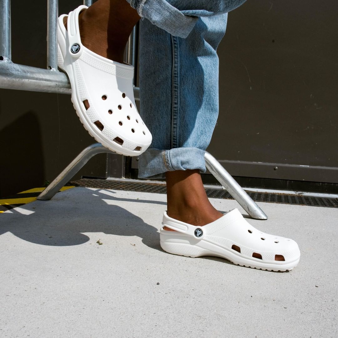 what size crocs to get if half size