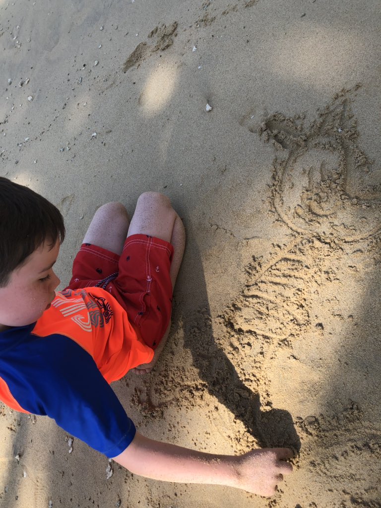 ms_ruddell's tweet photo. I wrote my name in the sand today. Then my own little artist drew his favourite supabuddies. Within minutes kids all over the beach were drawing and writing in the sand. #davpilkey #dogman #literacyiscontagious #notjustforschool https://t.co/2nbjhX8C9u