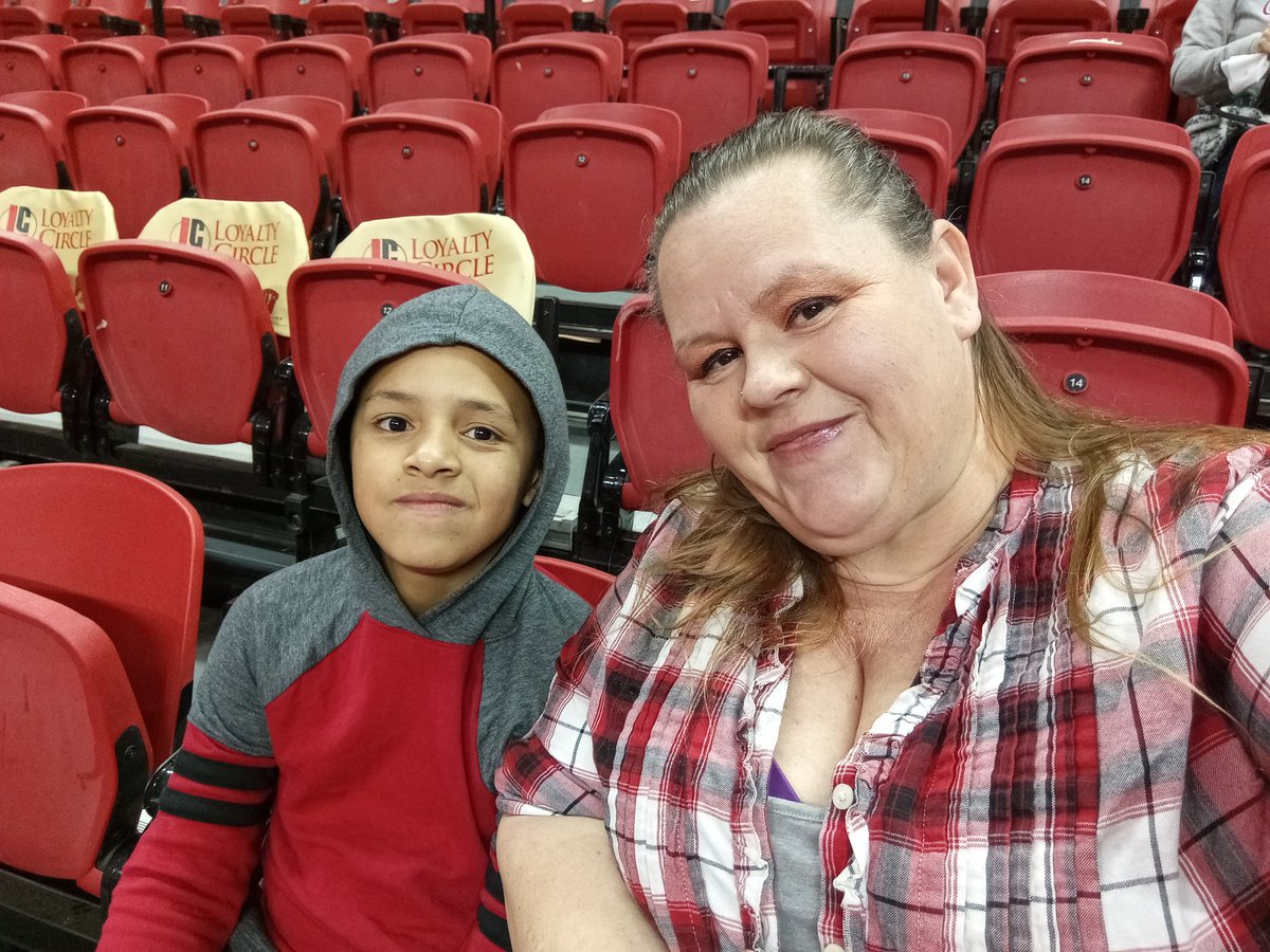 TLC_510's tweet photo. Decked out in scarlet and grey for our first @TheRunninRebels game. Jordan's eyes got so big when he heard @chetbuchanan. And the heard "Taco". #Score77 https://t.co/ZwLF4gAHXL