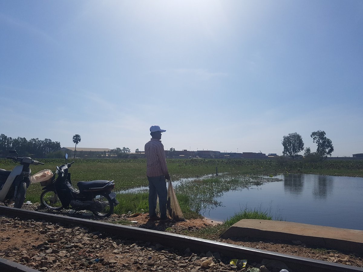 MechDara1's tweet photo. His wife works at factory and she stays at home, he come here to catch Mr fish. he said soon this small pond will be gone because #ChipMong started to fill it https://t.co/rEM8VgDWQZ