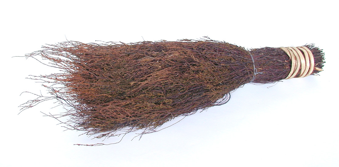 A photo of what's known as a besom broom head, made from heather and bound with two lengths of willow withy and one length of galvanised wire. A besom is a broom made from twigs!