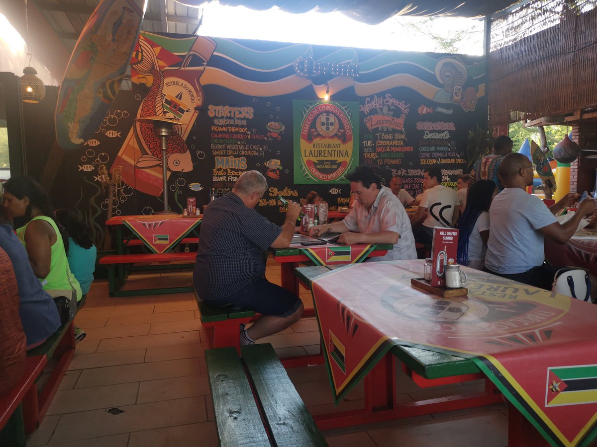 What a buzzy vibe! If you can't get Laurentina on tap brewed by a local brewer else you opt for the Suoer Bock on tap at R55 a pint.Mozambique's 2M in bottles R37. 50. Norm beer @ R30 per bottle. No beer on the menu. The food menu is authentic Moz and the food is really good.