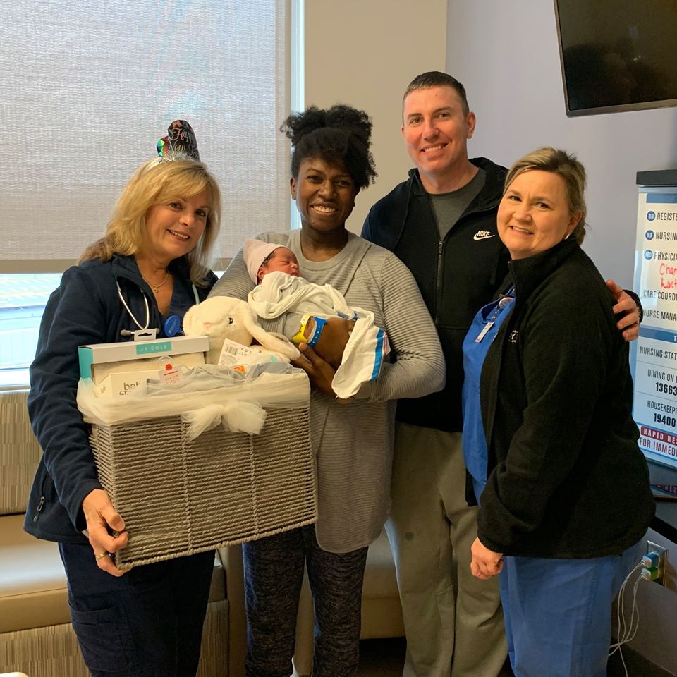 Congratulations to Nana Wilberforce & Jack Clark, the proud parents of Jemison, the first baby born at Princeton Medical Center in 2020. In celebration, Diana Thibodeau, RN (far left) presented the family with a gift basket containing baby clothes, baby care products, and toys.