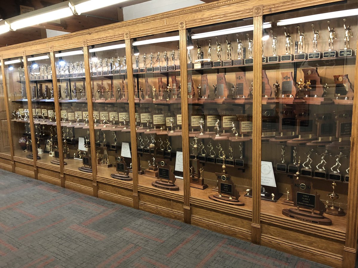 JRoopAD's tweet photo. Finally have all of the state &amp; conference trophies in the big trophy case. Thank you Judy Sobol for your help getting this knocked out today.  Next project is hanging the rest of the district plaques! 62 state trophies at HHS. Most schools are lucky to have a few! @BlackcatMatt https://t.co/PO5kssXkns