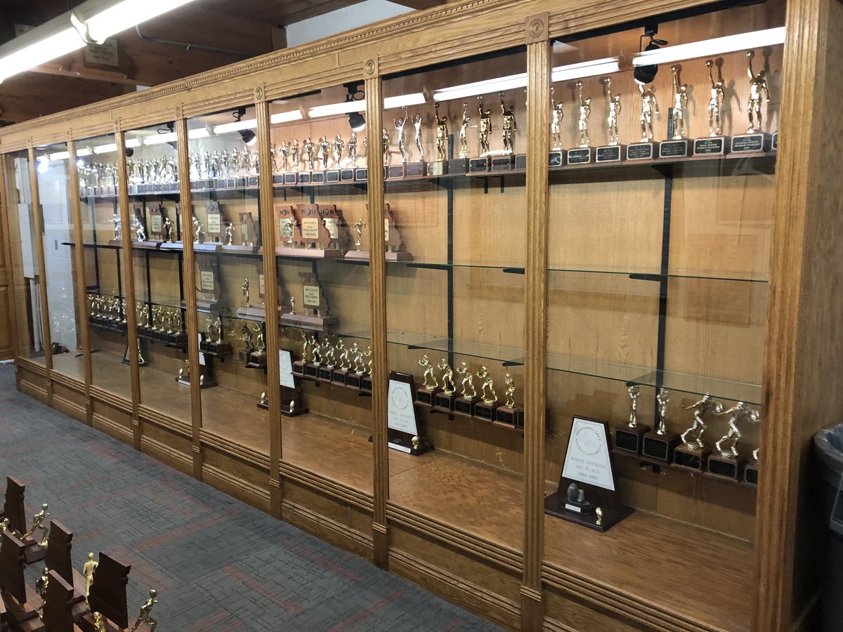 JRoopAD's tweet photo. Finally have all of the state &amp; conference trophies in the big trophy case. Thank you Judy Sobol for your help getting this knocked out today.  Next project is hanging the rest of the district plaques! 62 state trophies at HHS. Most schools are lucky to have a few! @BlackcatMatt https://t.co/PO5kssXkns