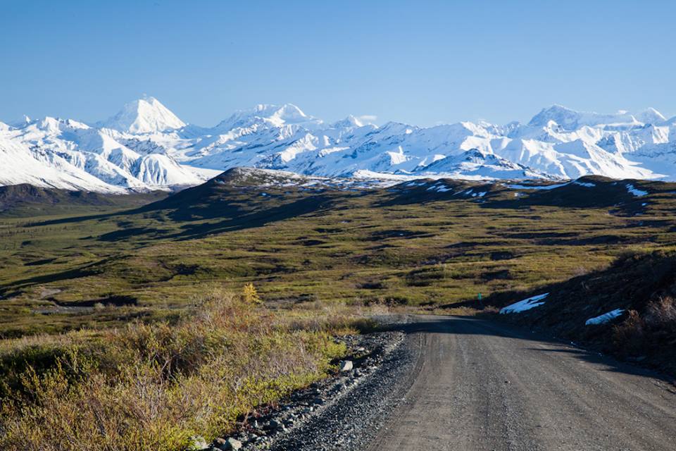route with mountains at the back