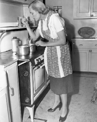 LaGuardiaWagner's tweet photo. Maybe cook more? (Susan Wagner cooking, c. 1953) #ArchivesResolutions https://t.co/8XoQM612Vo