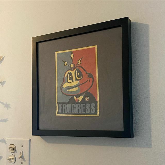 scottberks's tweet photo. When your better half takes an old worn out geocaching shirt out of your “garbage pile” and instead turns it into wall art. Love her! #geocaching #signalthefrog #frogress https://t.co/pmouaXItZM https://t.co/1mlToM3WUZ
