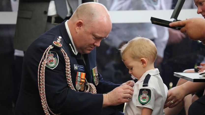 Jay_Beecher's tweet photo. Perhaps one of the most heartbreaking images I've seen for a while. Toddler today received medal on behalf of firefighter Dad who died in the #AustraliaBushfires  Reminds you of the huge sacrifices many make to keep the public safe and how much we often take them for granted. https://t.co/cucFfHMM2Z