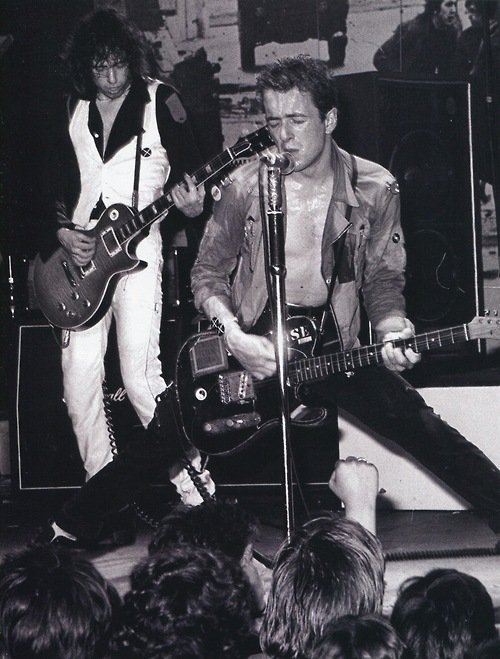 NewWaveAndPunk's tweet image. "Meanwhile things are hotting up in the West End alright
Contracts in the offices, groups in the night
My bummin' slummin' friends have all got new boots
An' someone just asked me if the group would wear suits"