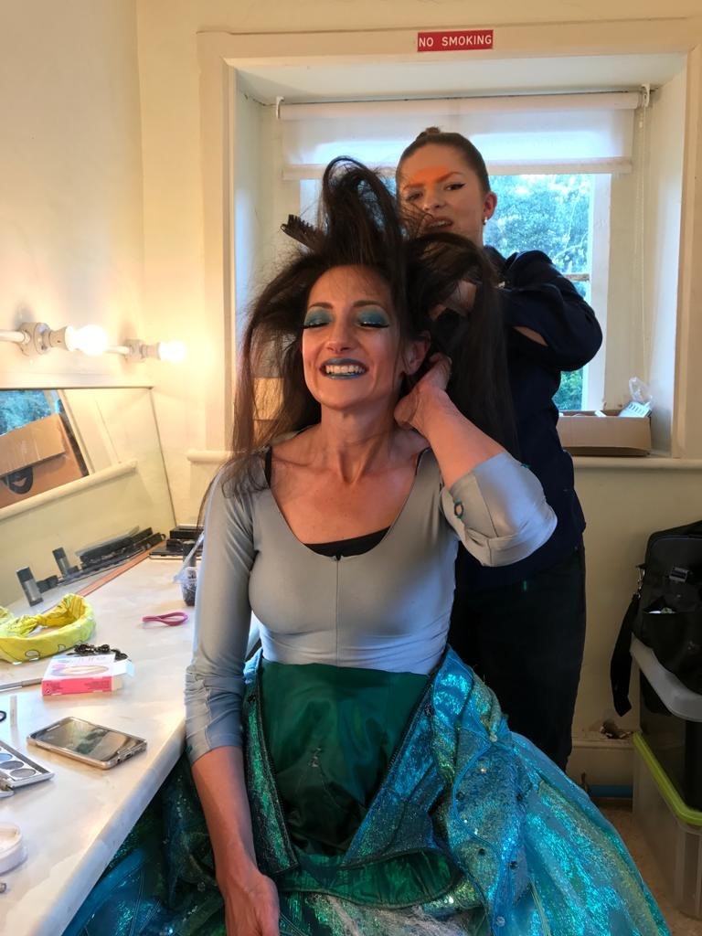 "Ill met by moonlight, proud Titania!"

The glitz! The glamour! The hair! Titania transforms into the Queen of the Fairies during our last production of A Midsummer Night's Dream! Sometimes, getting ready for a show is a real team effort! 🧚‍♀️

#MidsummerNightsDream #Backstage