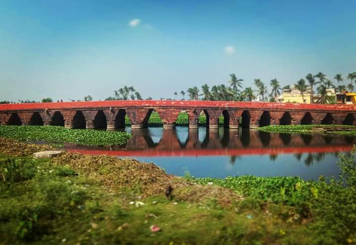 The Atharanala Bridge, Jagannath Puri. 

Legend has it that the king Indradyumna built this bridge. He was unsuccessful &amp; had to lose 18 sons to build the 18 vaults in the bridge. Hence called the atharah Nala - the 18 passage ways. 

Historically this bridge dates to 1700s.