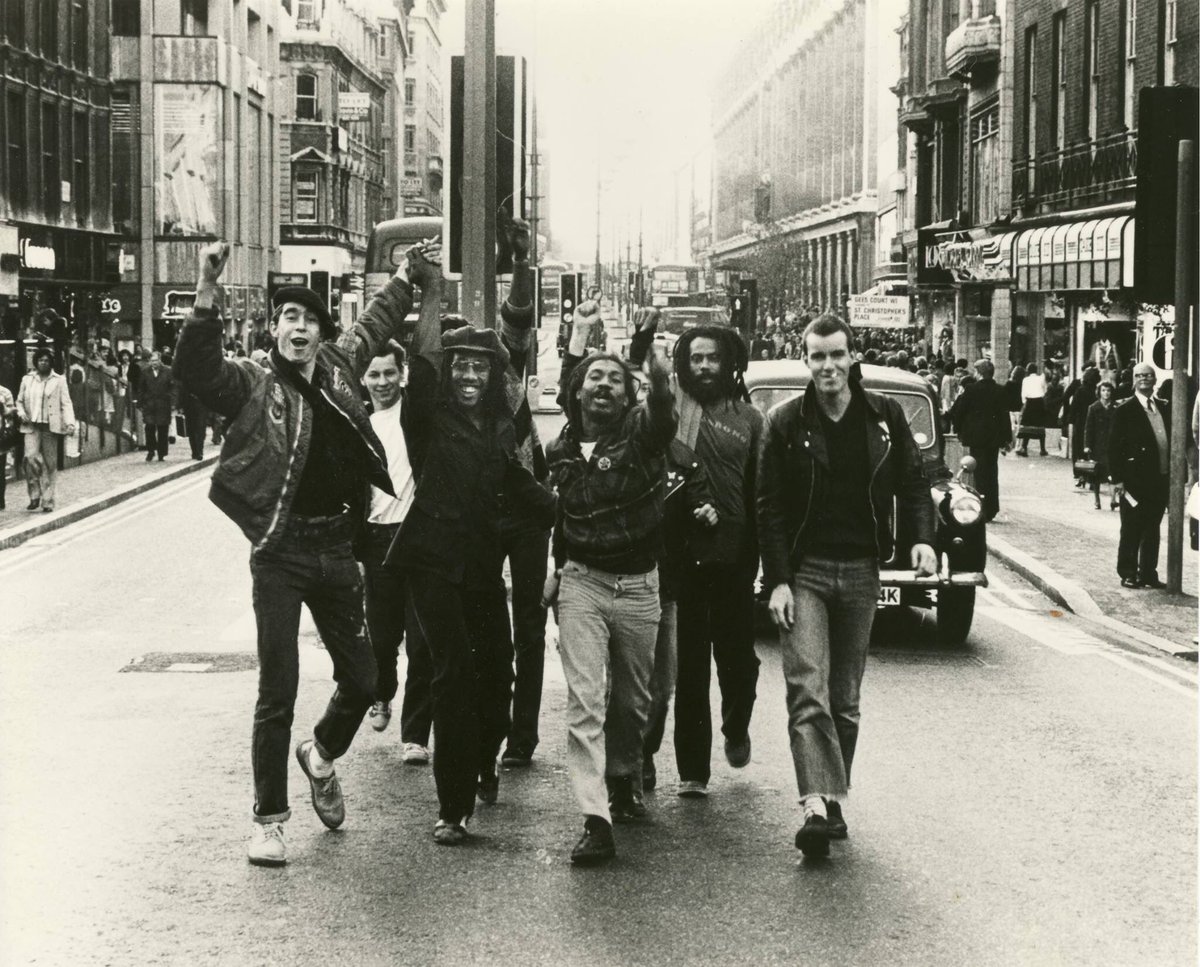 The Cimarons and Sham 69 talking a stroll down Oxford Street, 1979