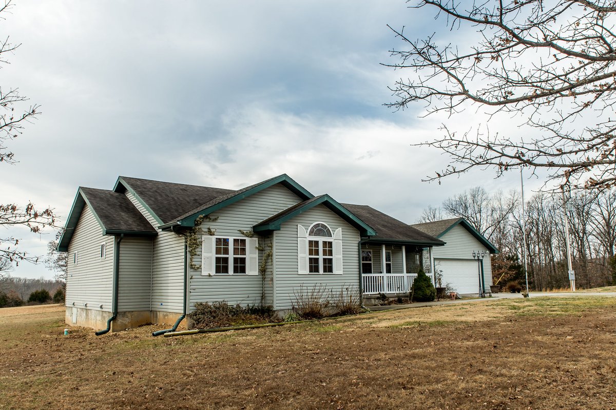 Beautiful Home with 25 Acres and a large shop for sale south of Urbana Mo
