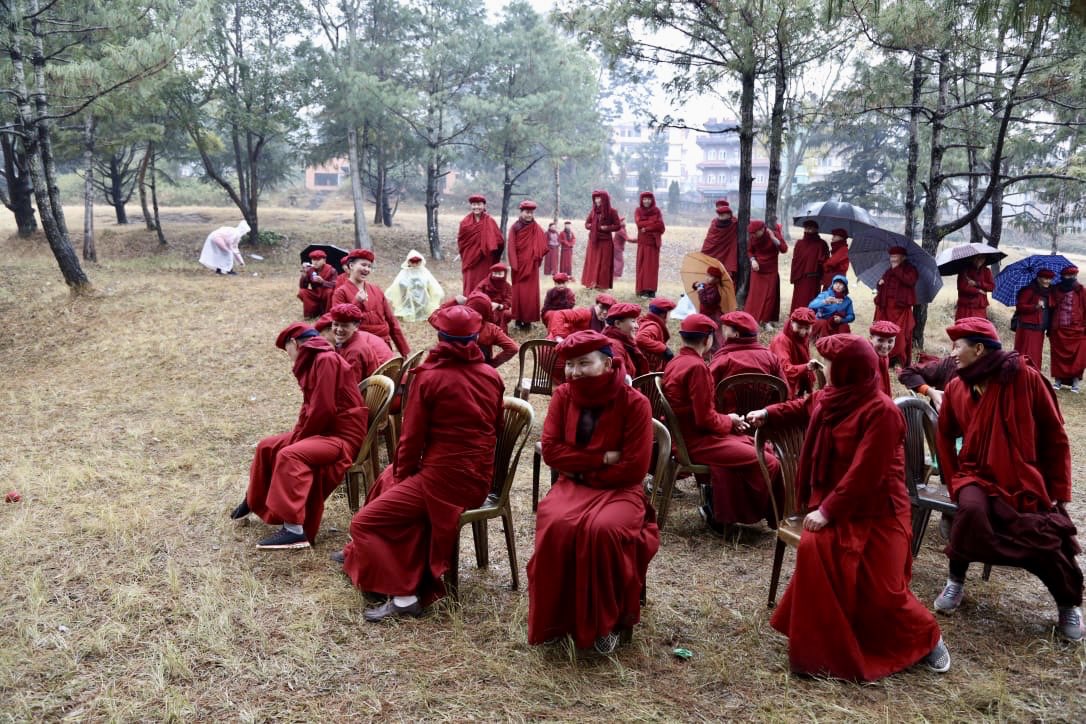 Drukpa's tweet photo. Today the #picnic continues in #Thankot, Nepal with laughter and joy, as the nuns and monks of #DrukAmitabhaMountain DGK Nunnery enjoy some outdoors time with rain included!
#KungFuNuns #DrukpaNuns https://t.co/362nnI9DLo