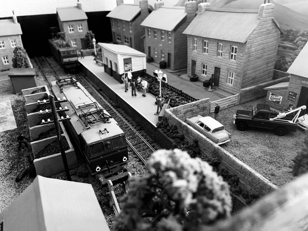 Busy morning at Townhead as Mentor glides in to a full platform with a Sheffield service with a lot of activity at Merlin Motors around a pair of new Ford Anglia’s Jason waits by the coalyard for the next service