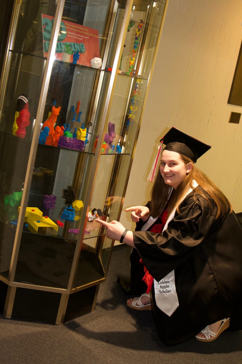 student pointing at a replica of her Royal Game of Ur pieces