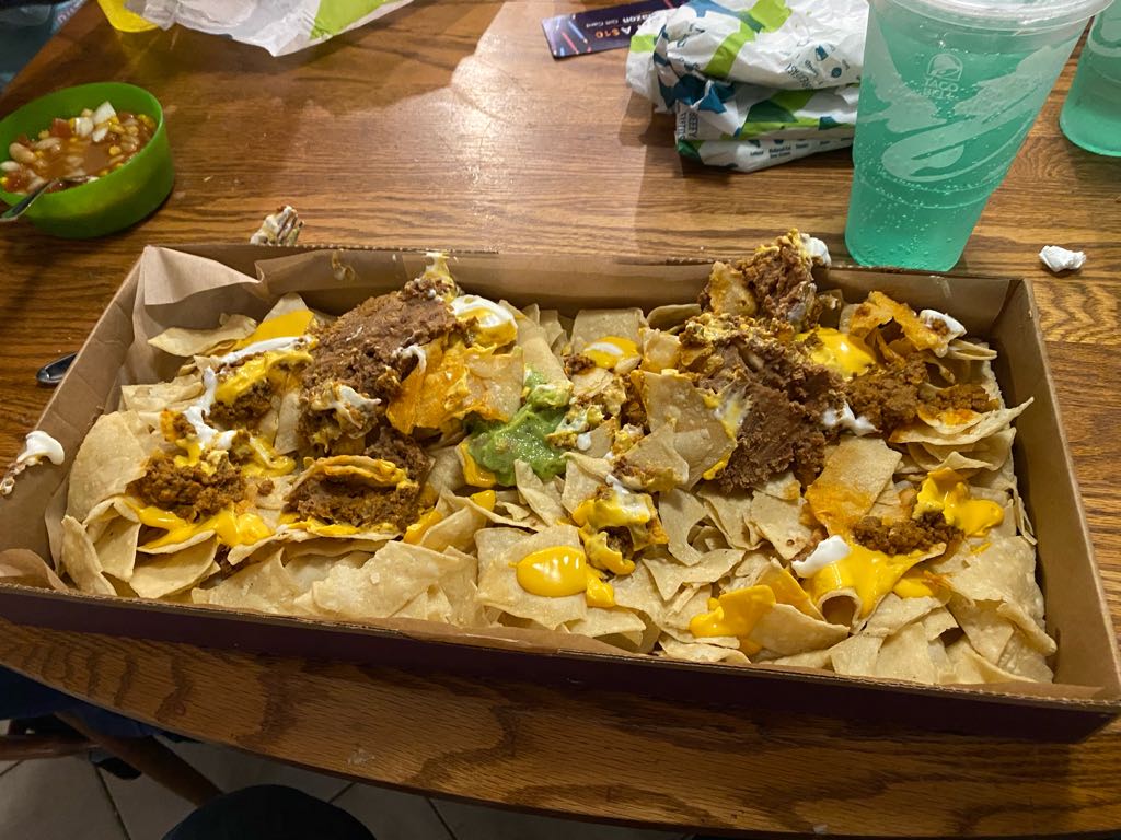 enoch17's tweet photo. Reall @tacobell this is your nacho party pack?  Doesn’t look like much of a party to me.  I also ordered 6 quesadillas for my kids and got 6 bean burritos instead. My kids don’t like refried beans. https://t.co/NtbApJdnFt