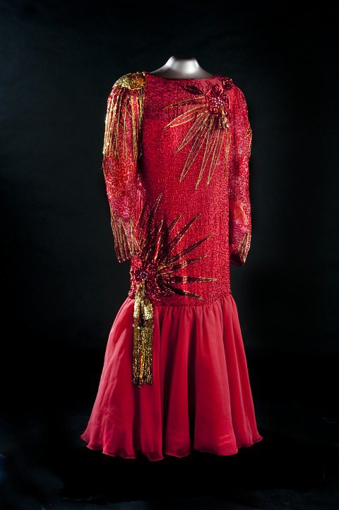 ICOMCostume's tweet photo. On the eleventh day of Christmas, a sparkling red dress, with gold highlights, worn by Puerto Rican singer and politician Ruth Fernandez 1919-2012 @amhistorymuseum #adozendaysofdresses #festivefashion #redrobes https://t.co/3cJF1PQu11