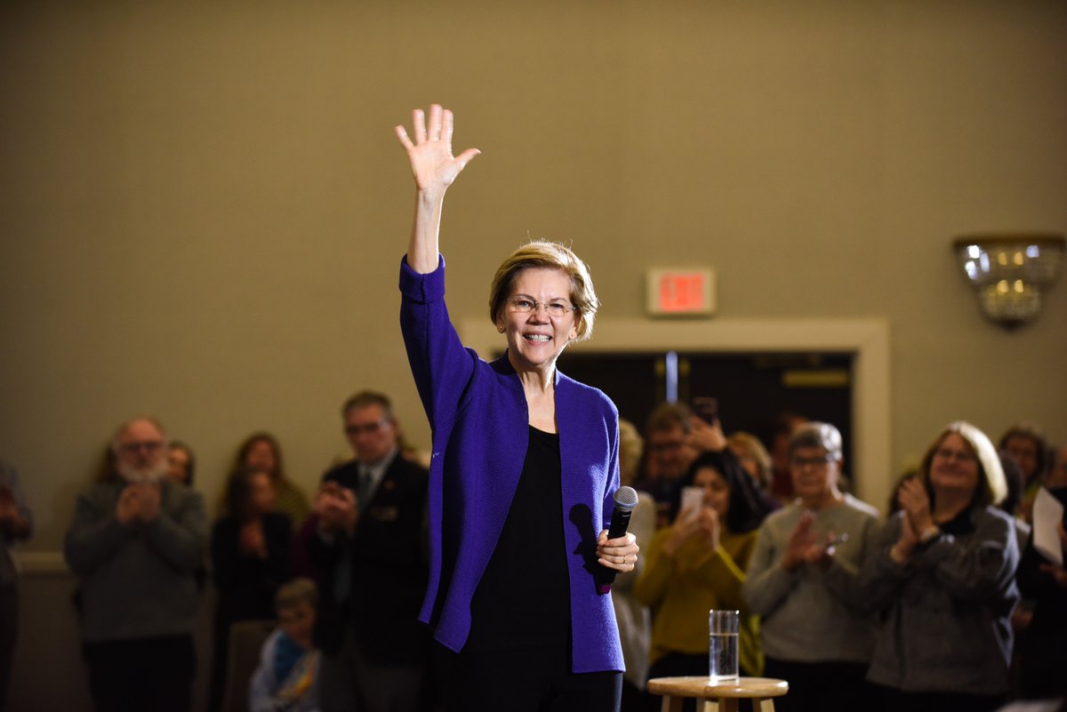 Elizabeth Warren waves to the crowd at the Concord town hall.