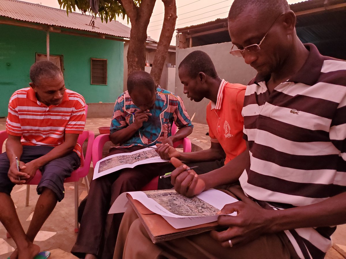 Members of the Ullo Water Community reviewing maps of the school grounds &amp; greater community re future water distribution needs that <a href="/EWBISU/">EWB ISU</a> may be able to assist with. Community engagement, needs identification &amp; assessment are key before considering a new partnership project!