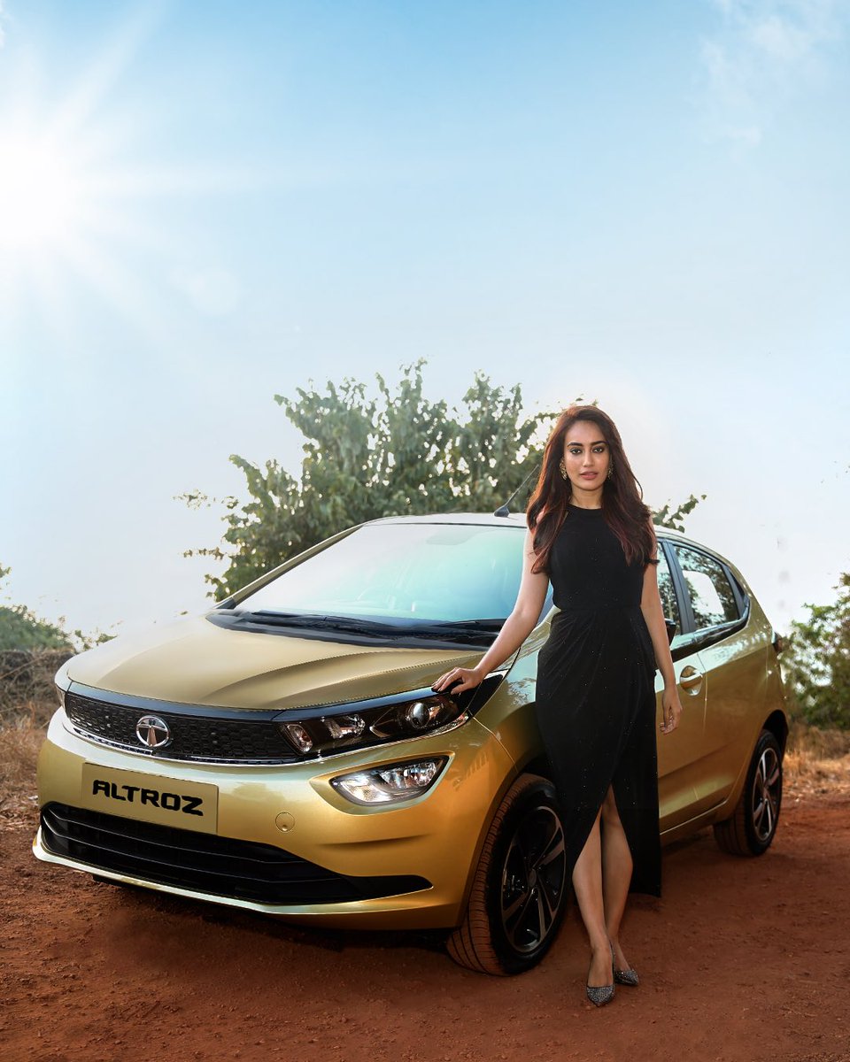 TataMotors's tweet photo. Taking on the city streets with her golden companion, here's Surbhi Jyoti reveling in her #ExclusiveAltrozExperience. Want to experience #TheGoldStandard too? Book the Altroz today! https://t.co/oHG7PJjNAB