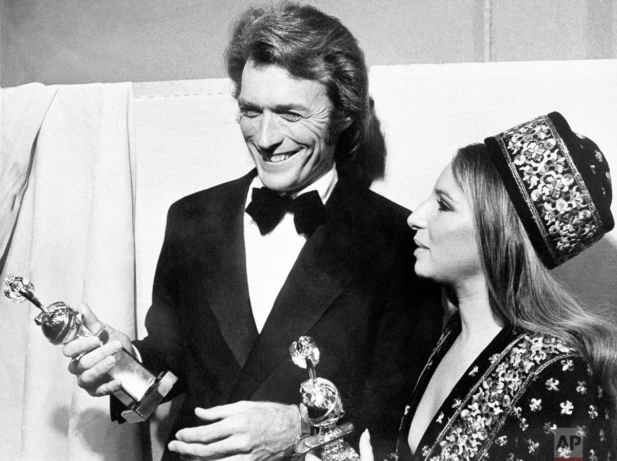 Photo shows Clint Eastwood and Barbra Streisand admiring... 