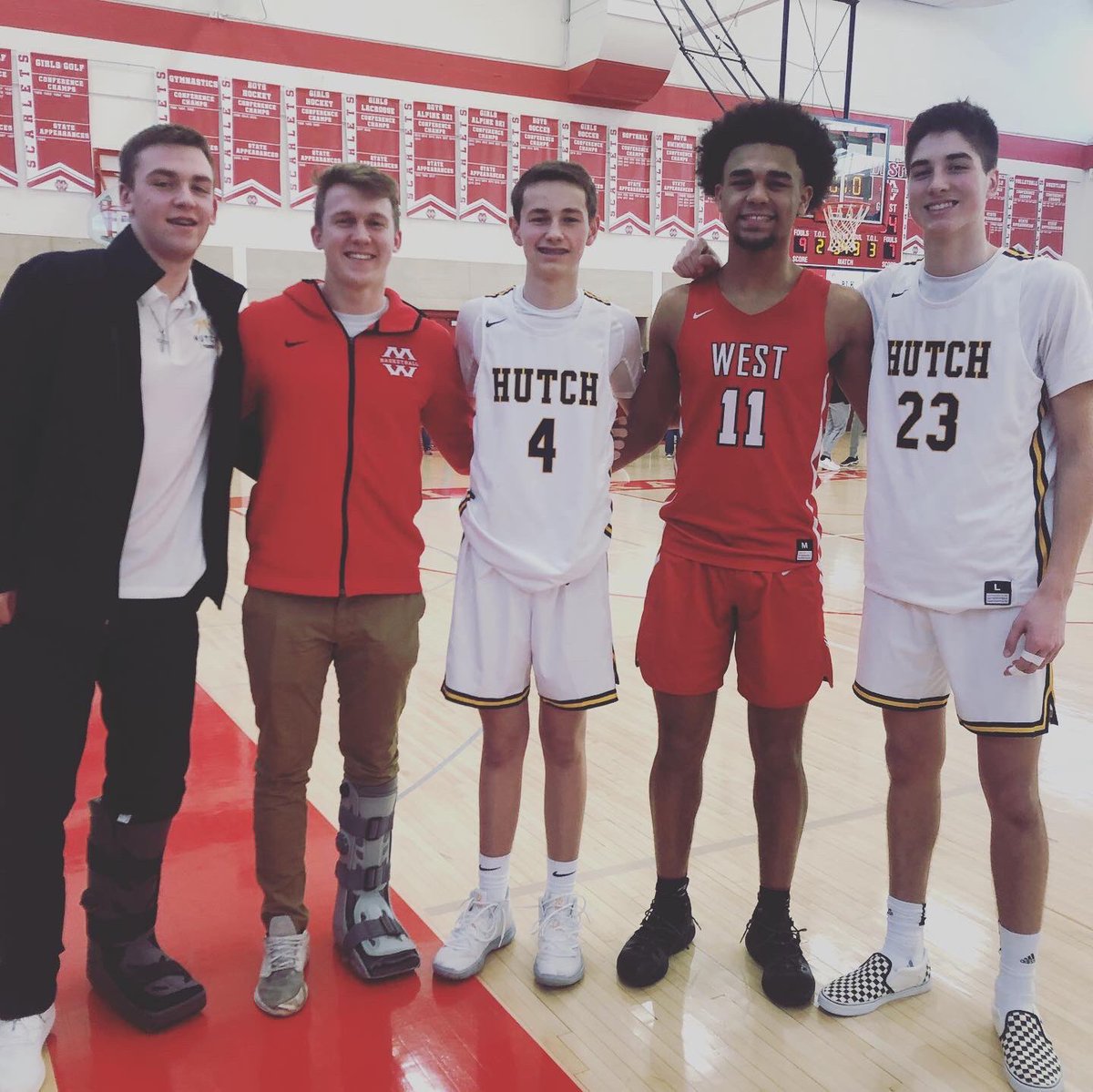 HaugumP's tweet photo. Basketball is more than a game, it creates friendships across families. Mankato West vs Hutchinson game opponents on the court and MN Rise alumni off.  Current MN Fury teammates supporting from the stands. #bondsthatbind https://t.co/mxNgYt2mKr