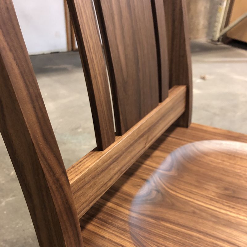 Featured here is our new Kenton dining chair in Eastern Walnut with a wood seat. Inspired by our Kelly chair, it features the same lumbar support as our Kelly Chair but with a simpler design.  #handcraftedfurniture #madeinpdx #designedforlife