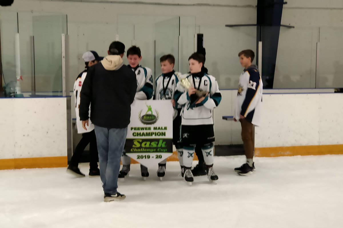 Two time SCC Champions Degelman​​ and his Saskatoon Mission passing on the trophy to this year's winners.  Chris Mathies and his Marauders have bragging rights for the next year.