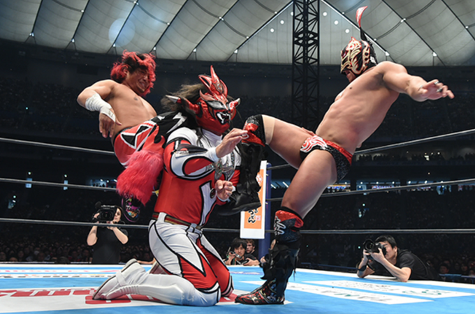 Ryu Lee and Hiromu Takahashi attacking Jyushin Thunder Liger During their Tag Team Match