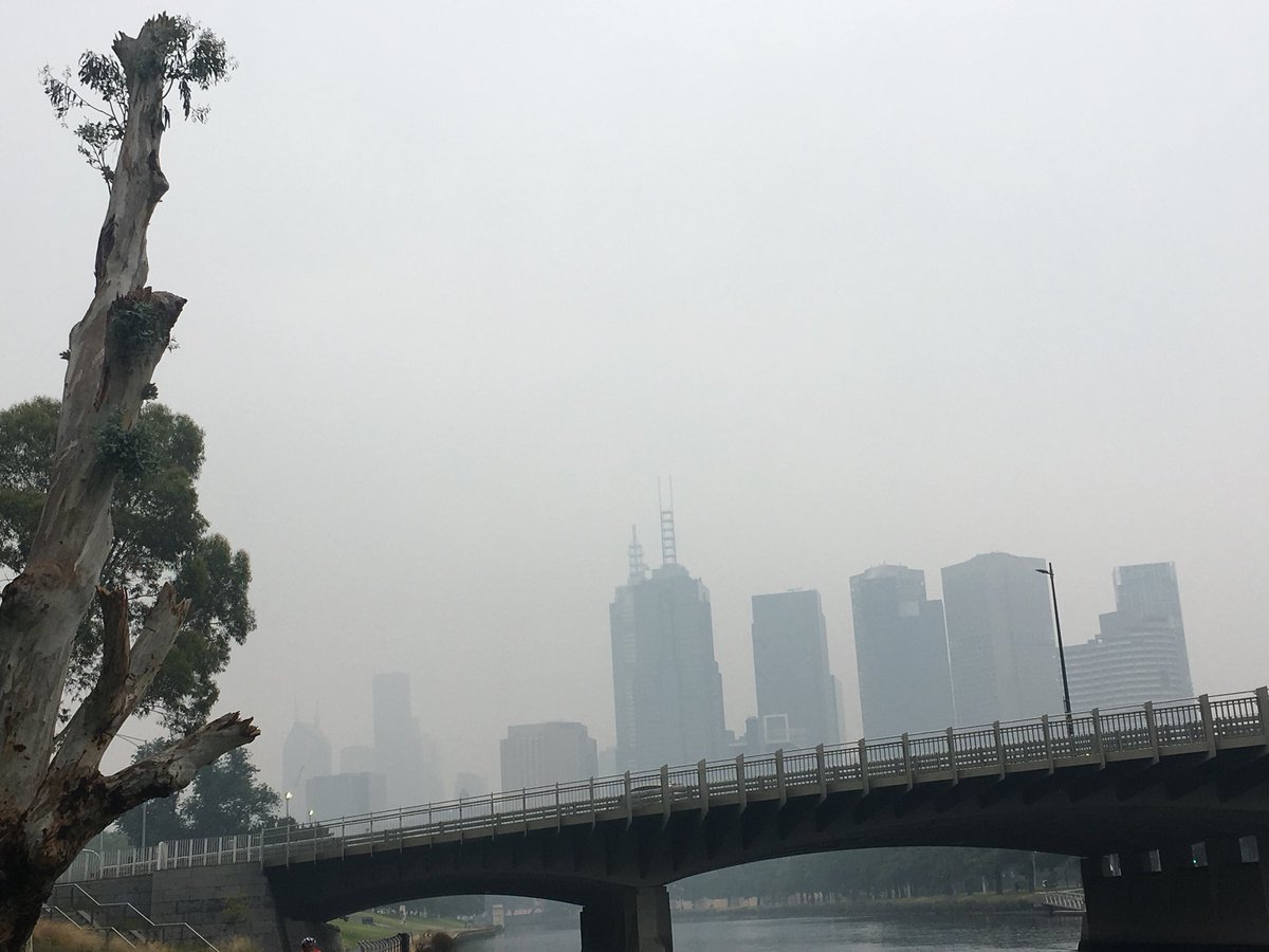 Looking north west towards #Melbourne’s skyline mid-afternoon from the river - #bushfiresmoke obscures the usual pretty postcard image 6 Jan 2020