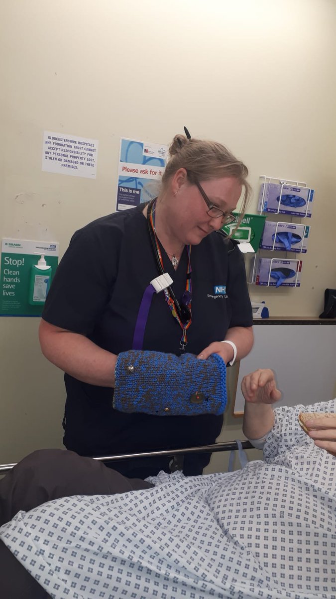 gloshospitals's tweet photo. Consultant Tanya is here providing a patient with a twiddle mitt, which helps patients who are living with dementia when they come into the A&E. Having something to 'twiddle' helps to calm agitation and restlessness and they're all made by volunteer knitters #AandELive https://t.co/XS3Y6oWrQg