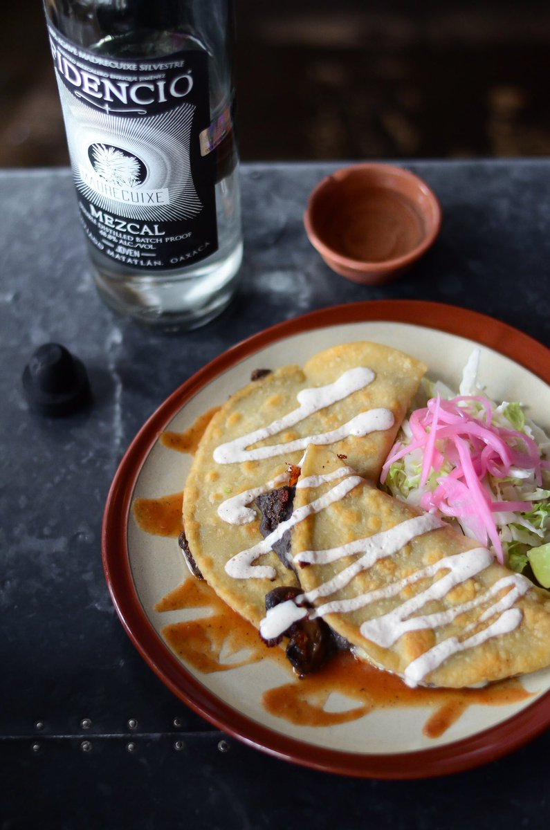oaxacan mushroom🍄quesadillas with salsa quemada, chihuahua cheese, black bean purée + crema. pro tip: enjoy with your favorite #mezcal for the full experience 🤓