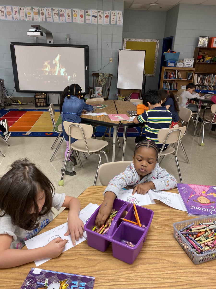 PreK listened to There Was a Cold Lady who Swallowed some Snow and then colored a winter booklet by the “fire”.