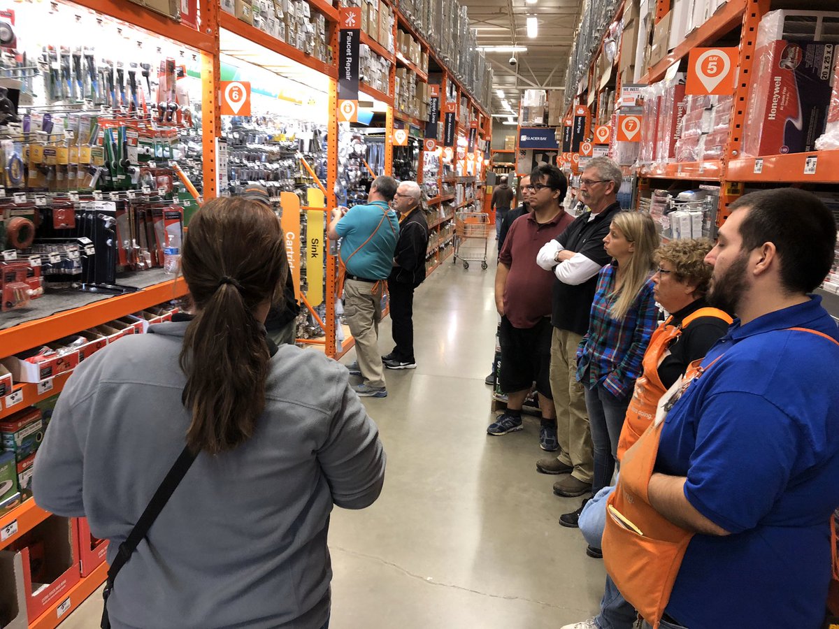 PK with fellow department supervisors in the aisle on general service standards