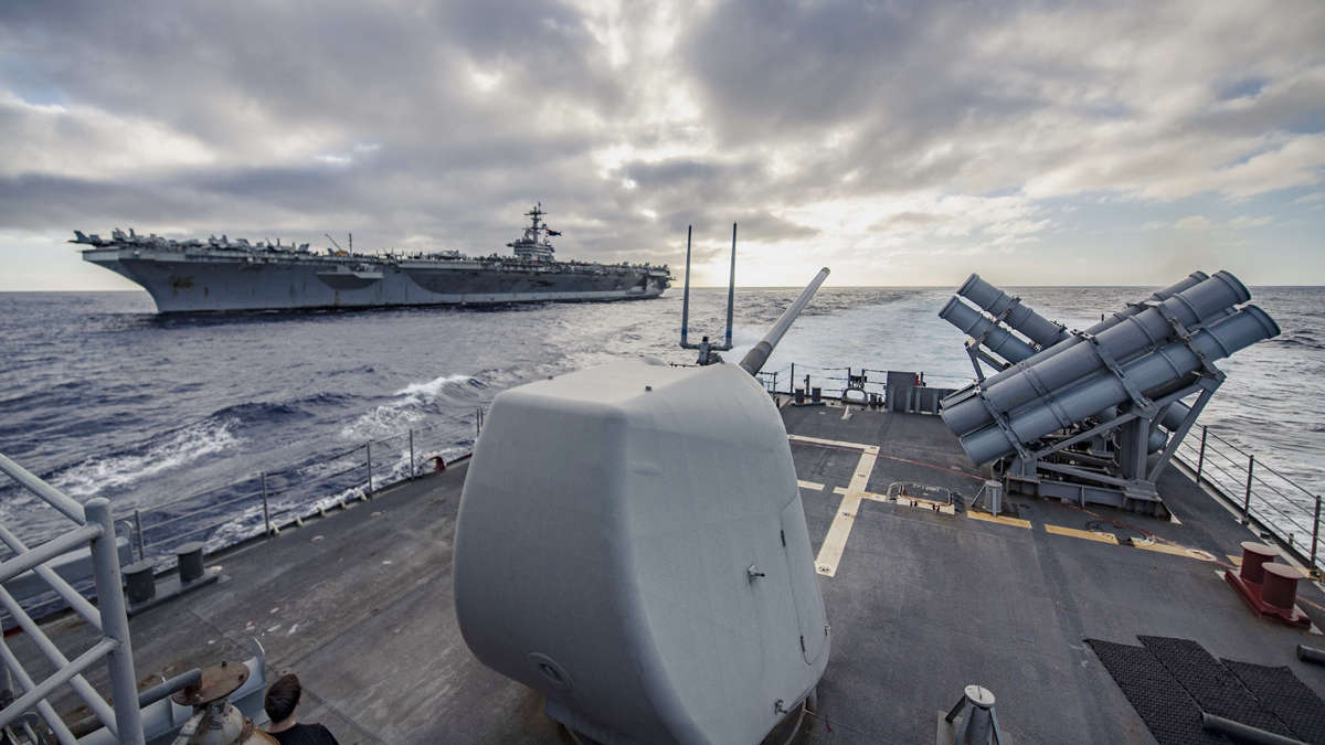 The guided-missile cruiser #USSChancellorsville transits alongside the aircraft carrier #USSAbrahamLincoln during operations in the Western Pacific this past weekend. #CG62 #CVN72 #USNavy