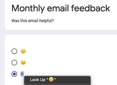 Sad emoji face rendered in the textual variation next to neutral and happy emoji faces that both render in their emoji variation.
