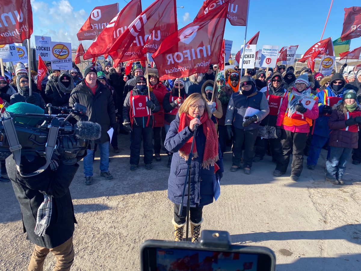 UniforTheUnion's tweet photo. "Co-op will not bust our union by using profits only made possible by members' hard work," @Lanampayne announces Unifor's coming escalation at a rally for @Unifor594 members. https://t.co/I92QuRhSJW 
#Unifor #BoycottCoop https://t.co/BkrBwtzUF9