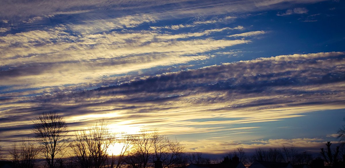 today's sunrise at 2 slightly different times.these clouds signified the snow that came later in the day.(#2)