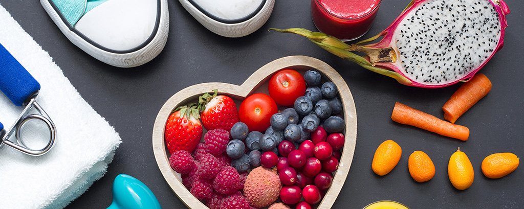 a photograph of fruits vegetables and sneakers