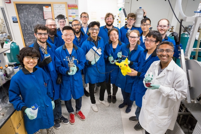 group of scientists in lab coats in a lab