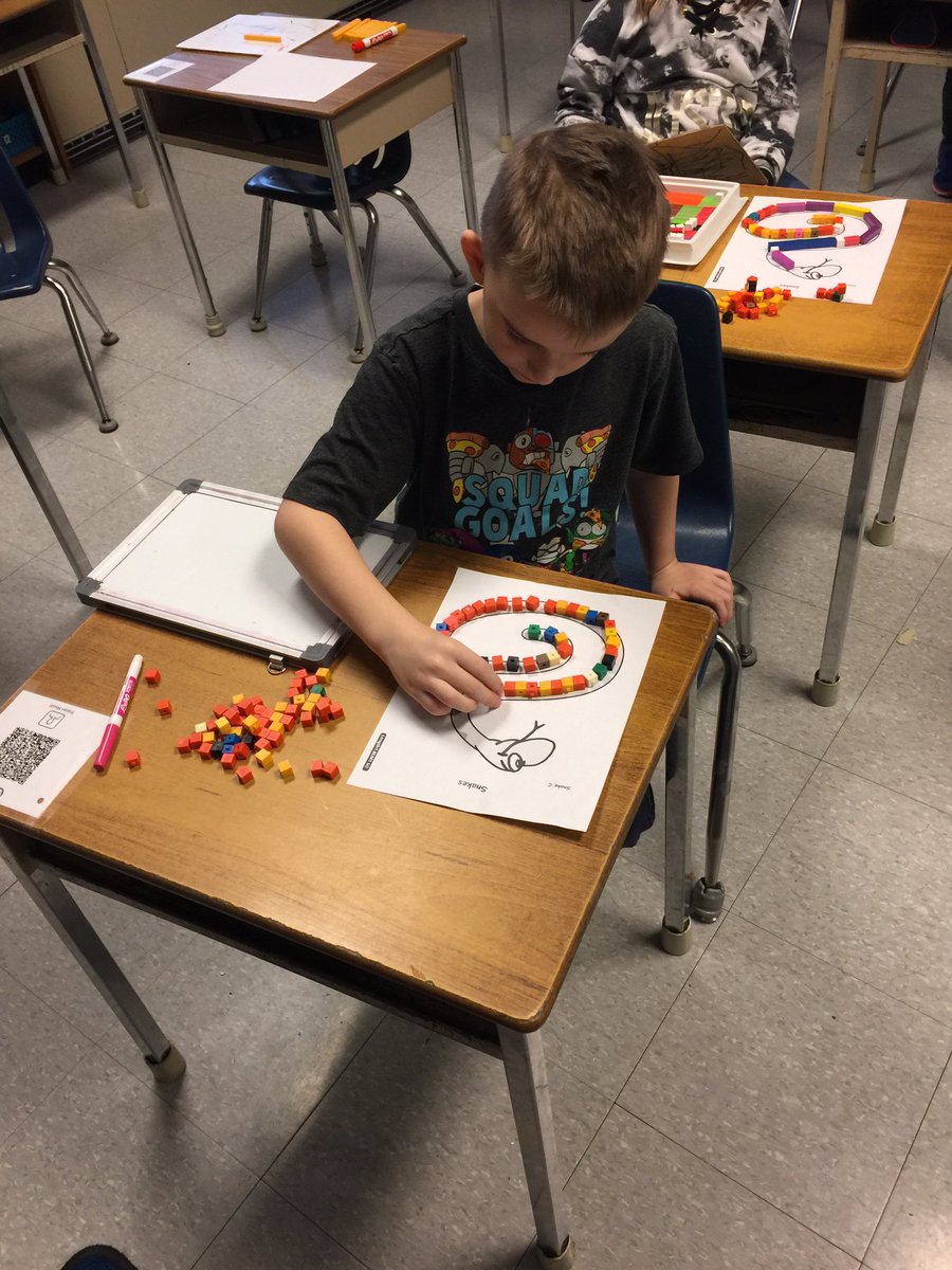 StBasil2021's tweet photo. Students are using relational rods to estimate, measure and describe area.  How much surface does the snake and/or newspaper photograph cover?! https://t.co/Thxa0qpdLp