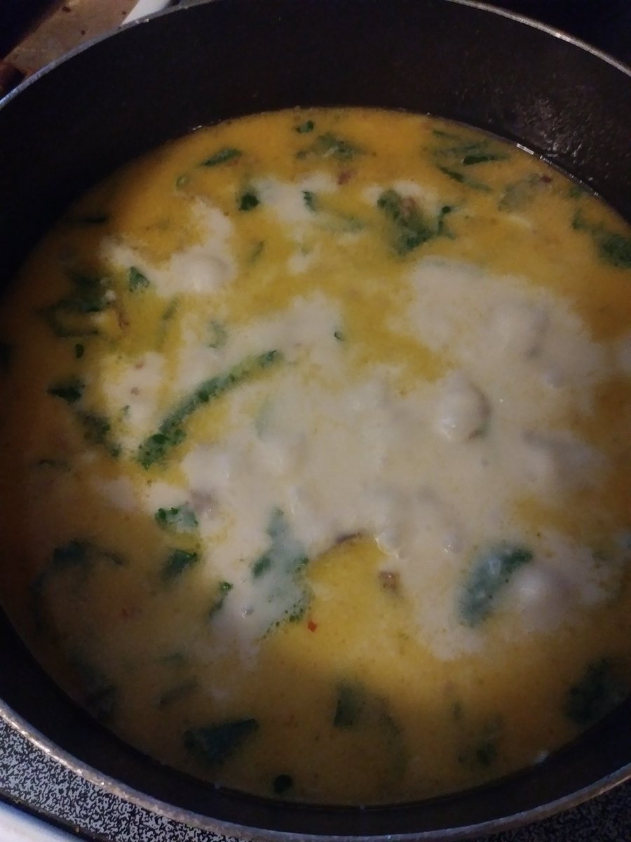 (cw: food)AWRIGHT LET'S END THIS. Once the potatoes are tender add about a cup of heavy cream, one of those milk carton looking jawns will be adequate. Also a LOT of kale, ripped untimely from its stems. Heat through, stir a LOT, the cream and the broth love to separate.