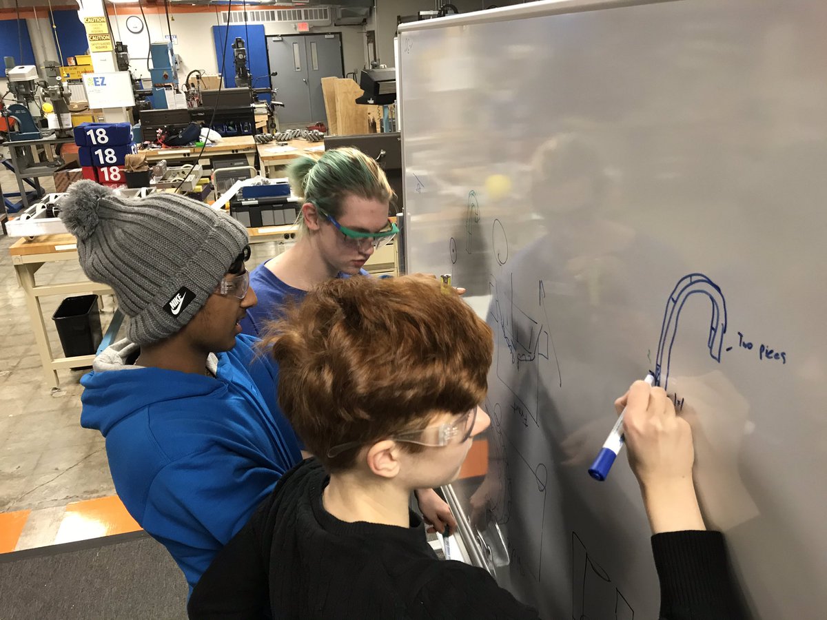 STEMKC's tweet photo. @kcpublicschools @FRCTeams @Tigerbytes1775 team busy at work today in the #kcez with their @BurnsMcDonnell mentor!  Computer Science, machines, math, innovative engineering and mentoring-great Tuesday in the Zone! Thanks @honeywell for the machines. https://t.co/B9UhN35fNL