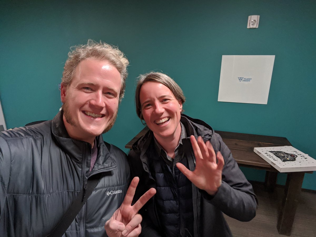 Smiling Rubyists waving for the camera.