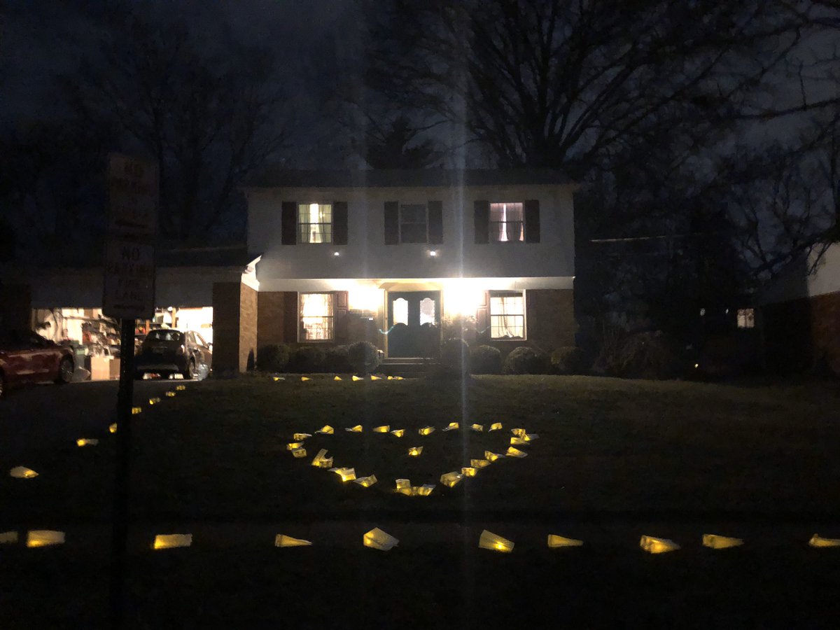 157. One of the kids just discovered that somebody arranged Japanese lanterns with tiny LED lights inside in the shape of a heart on our front lawn.